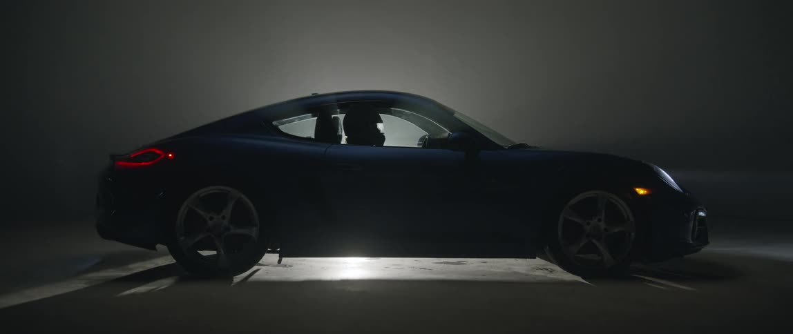 The car is parked in the dark