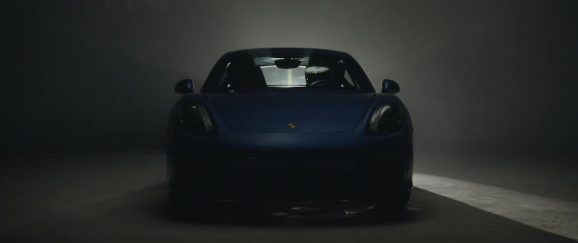 The sports car is parked in the dark