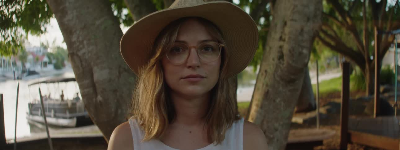 A woman is standing in the park