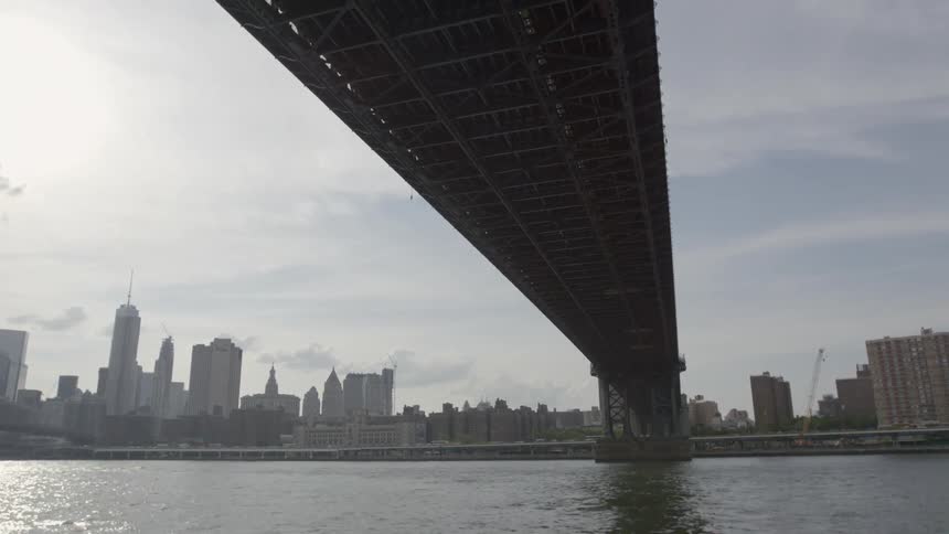 A bridge over a waterway in big city