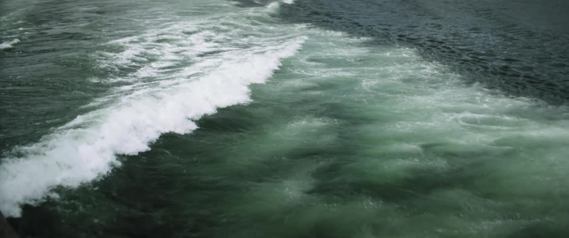 An aerial view of an ocean is displayed