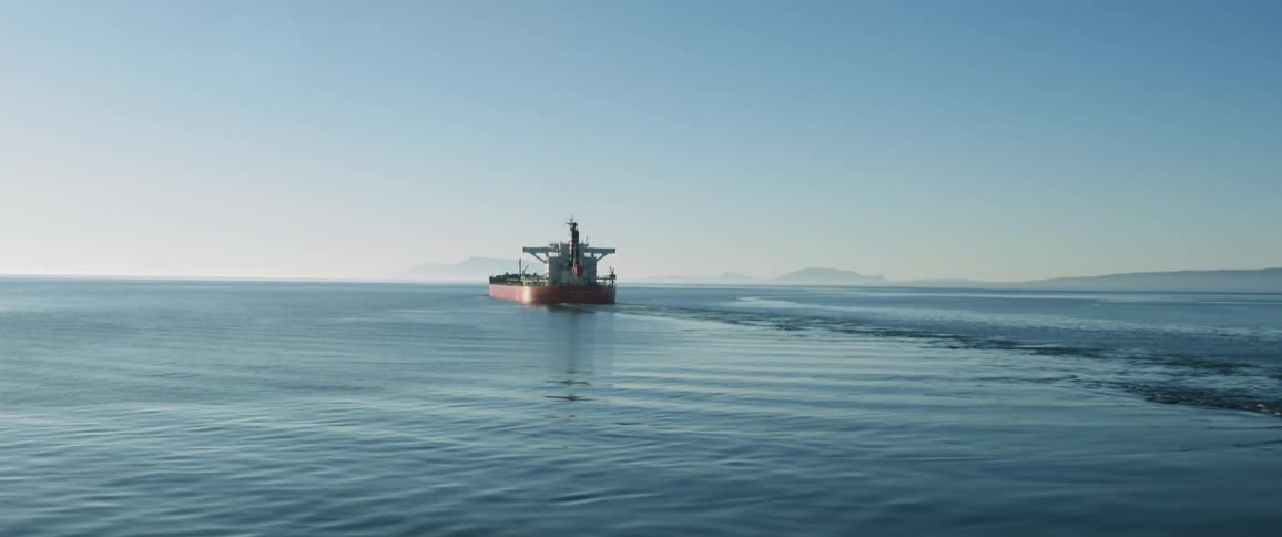 A boat is moving across the ocean