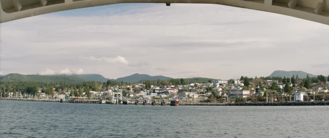 A view of a lake and skyline from a boat