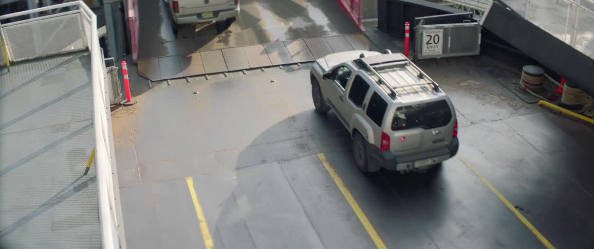Vehicles travel onto a bridge