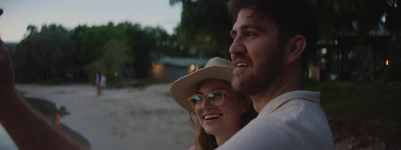 A couple take a selfie on the beach