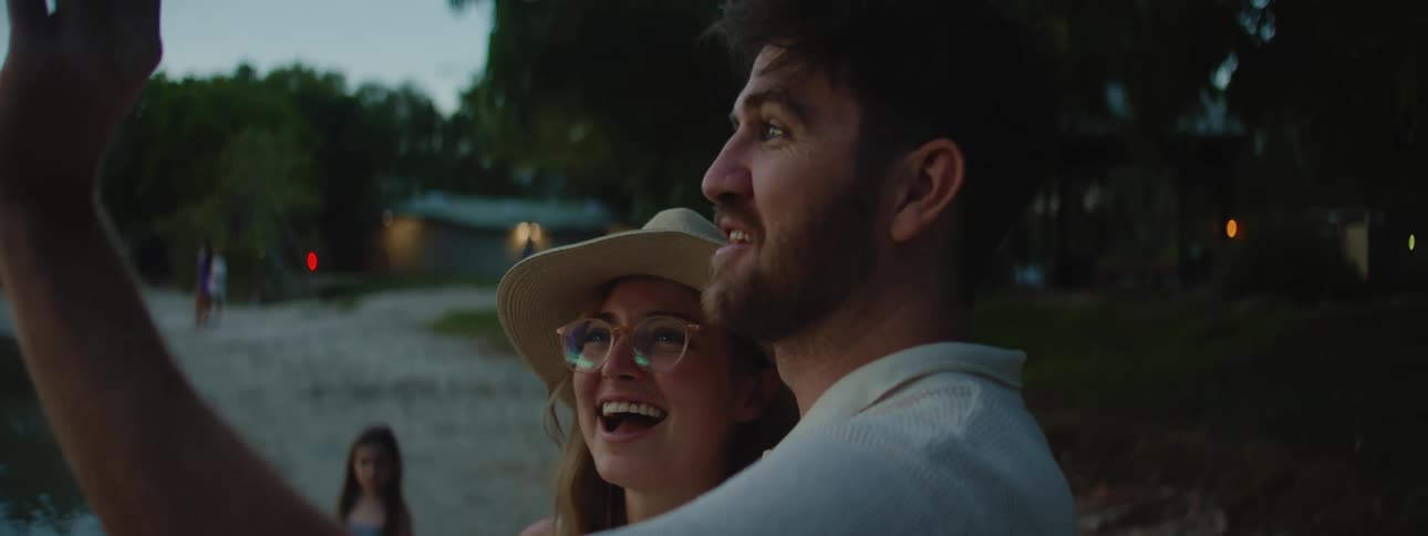 A couple take a selfie on the beach