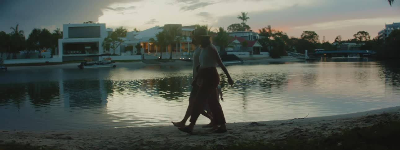 A family walking on a on a riverside