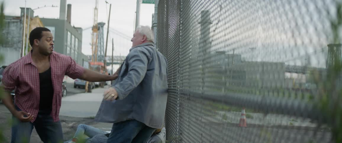 Old man fighting younger men and getting punched in the stomach