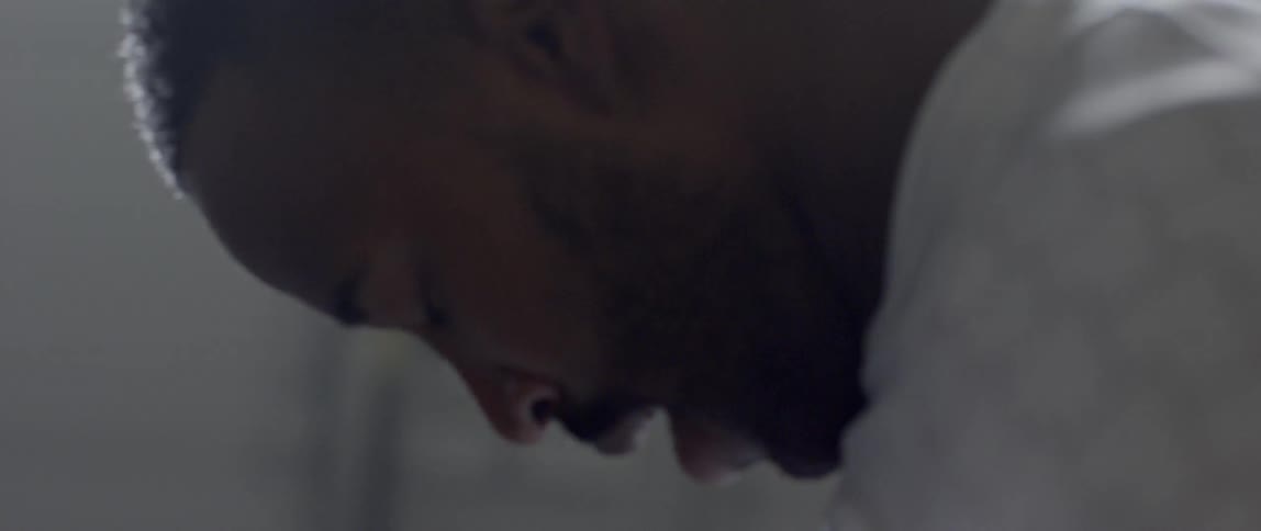 A man breathes heavily during a workout