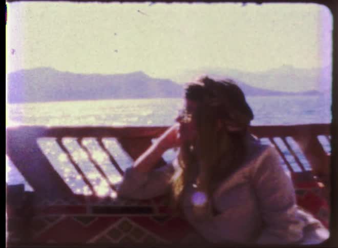 A vintage film of someone riding on a boat