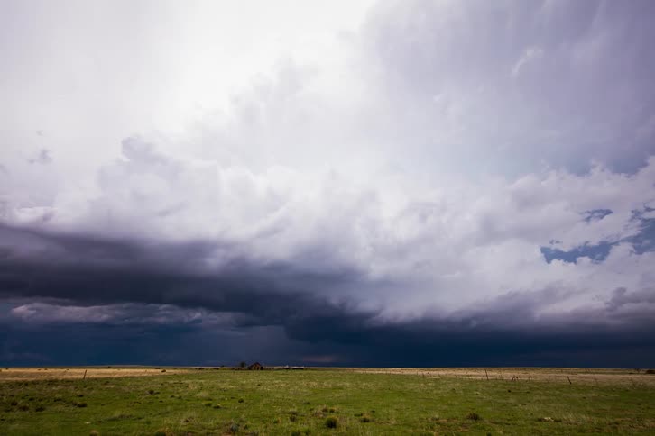 A time lapse of a heavy storm forming over a field