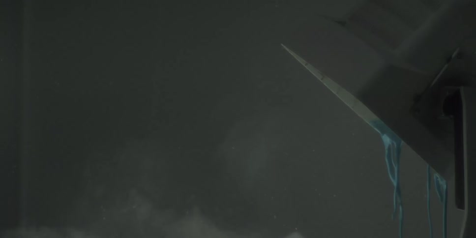 A man smashes a monitor with a sledge hammer