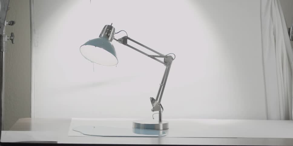 A desk lamp is flashing and oozing thick blue liquid