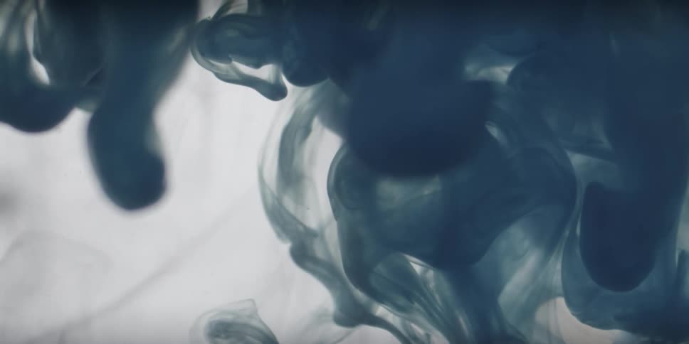 Dark blue liquid swirls around