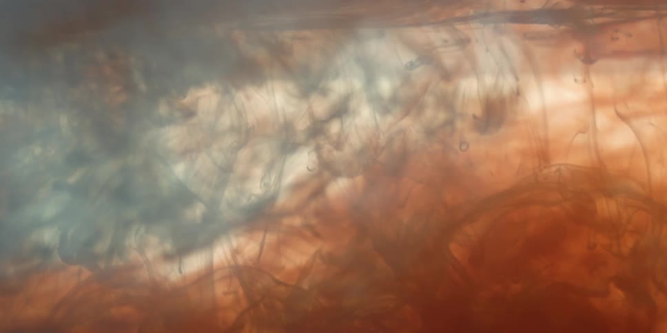 Orange and blue clouds in liquid
