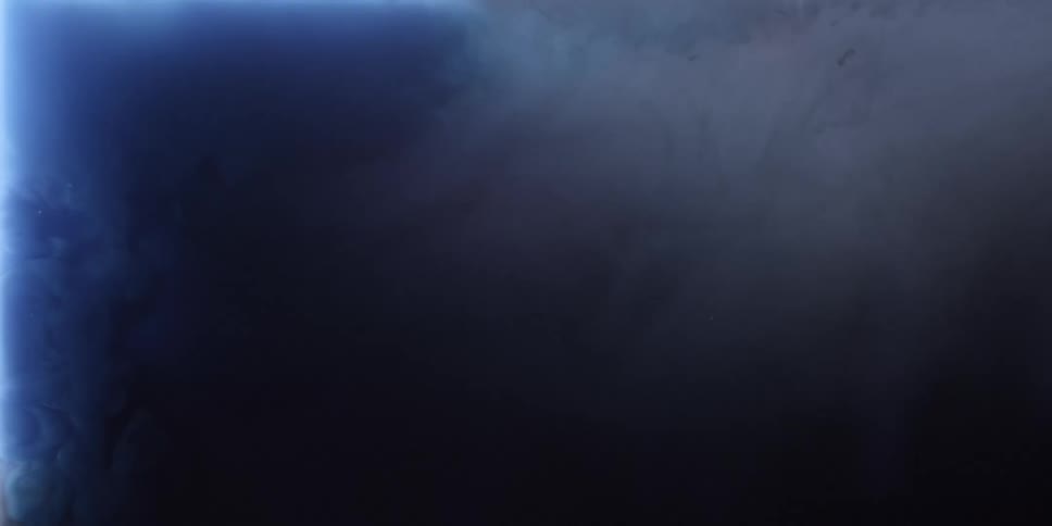Dark blue liquid swirls around