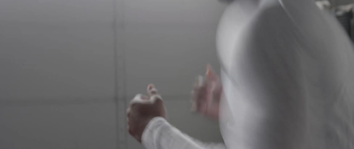 An athlete is practicing boxing moves as he works out
