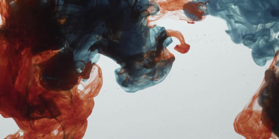 Blue and orange liquid swirling