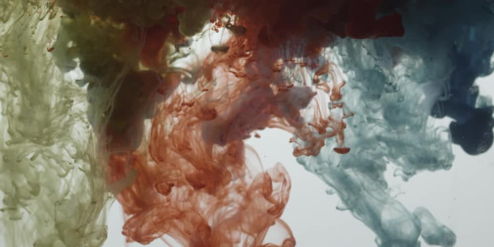 Liquids of various colors inside other liquids