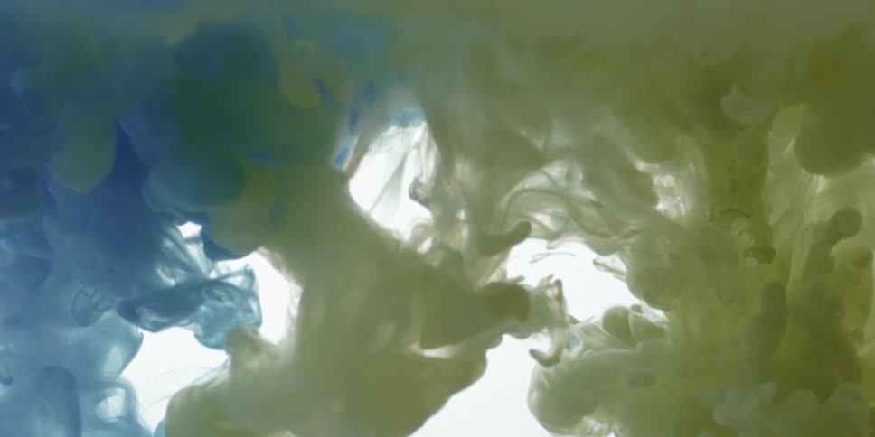 Yellow and blue liquid swirling