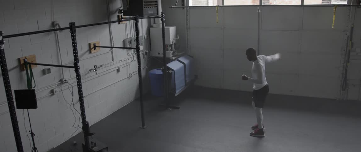 A man is running in place and stretching