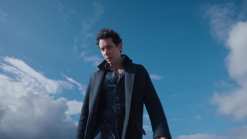 A man is hiking on the field