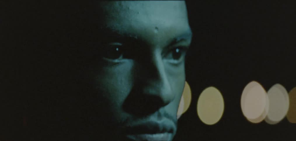 Mans face on the street at nighttime