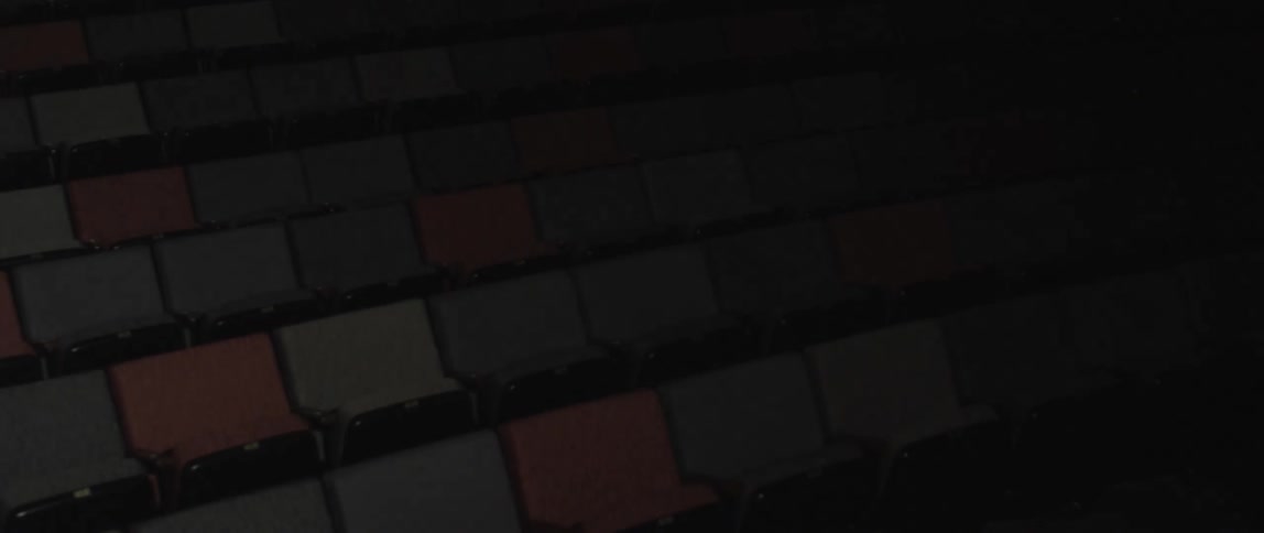 The lights slowly turn on in the empty theater