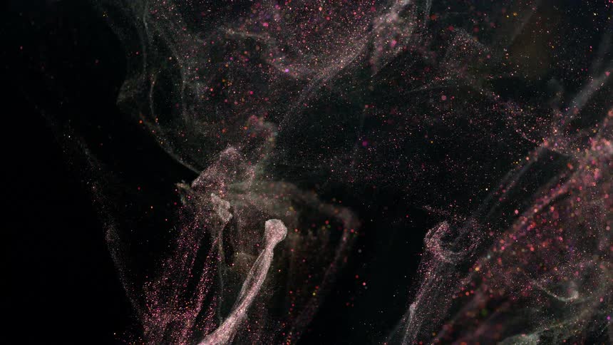 A turbulence of glitter and particles moves in a fishtank