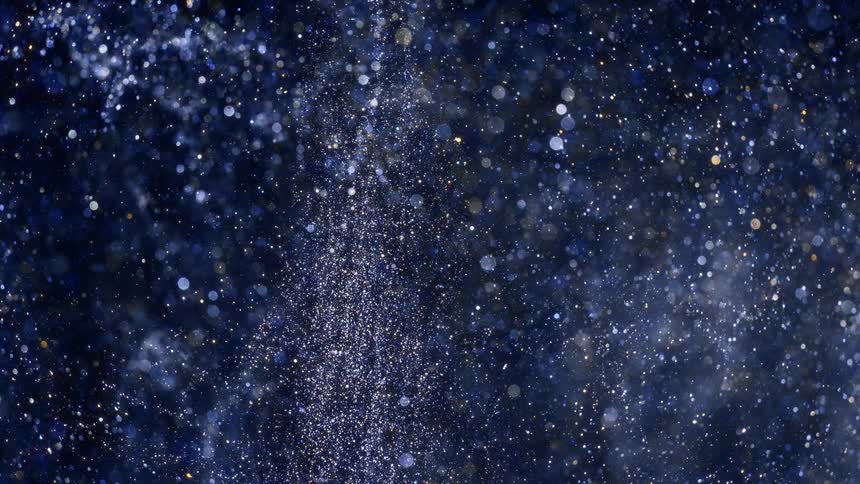 liquid silver paint sparkels and flows in the arsty scene