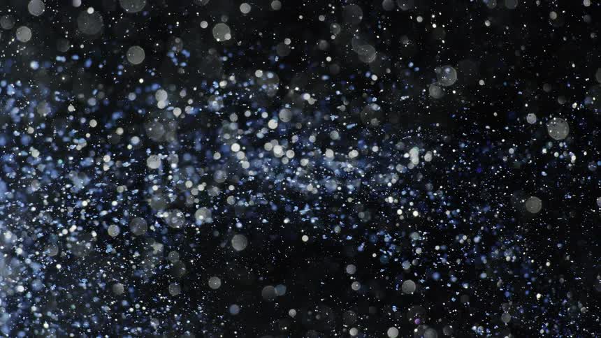 Blue crystal shards float across black background strewn with white translucent spots