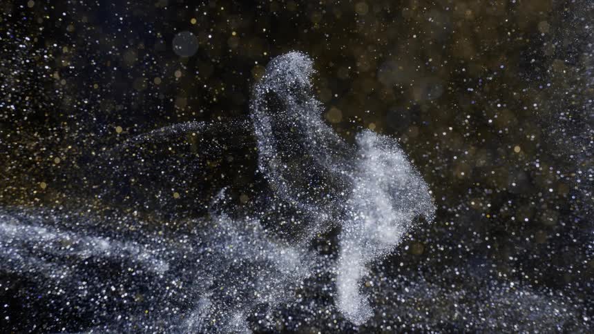Glitter sprays around the area