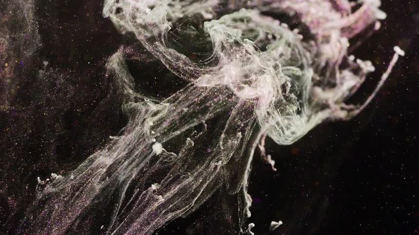A cloud of glitter shoots out
