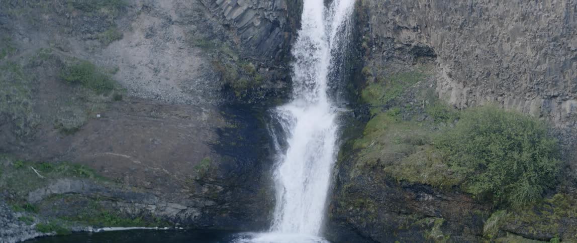 Water falls down the cliff