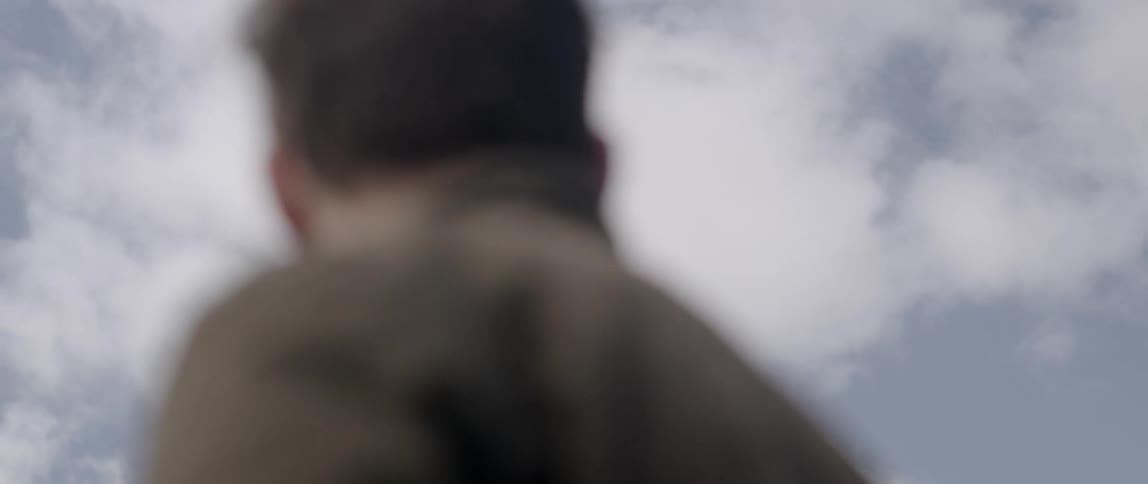 A man stares outside