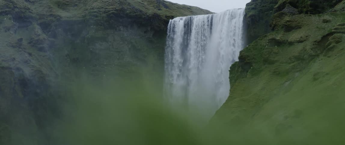 Water falls down the cliff