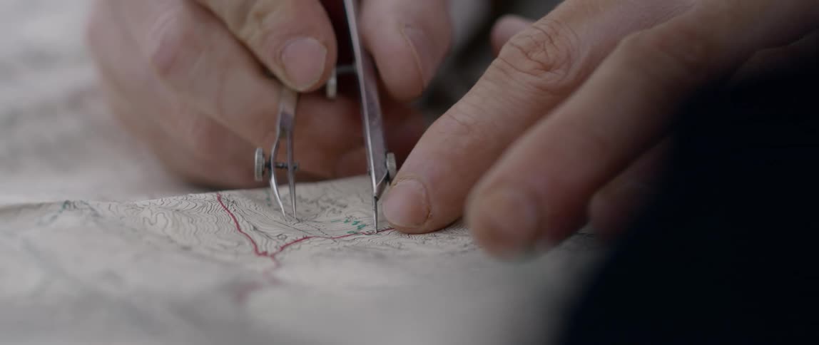 Elderly man finger pointing something at the map