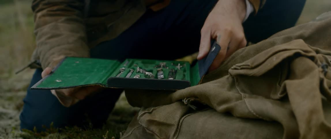 A man goes through a small tool clutch