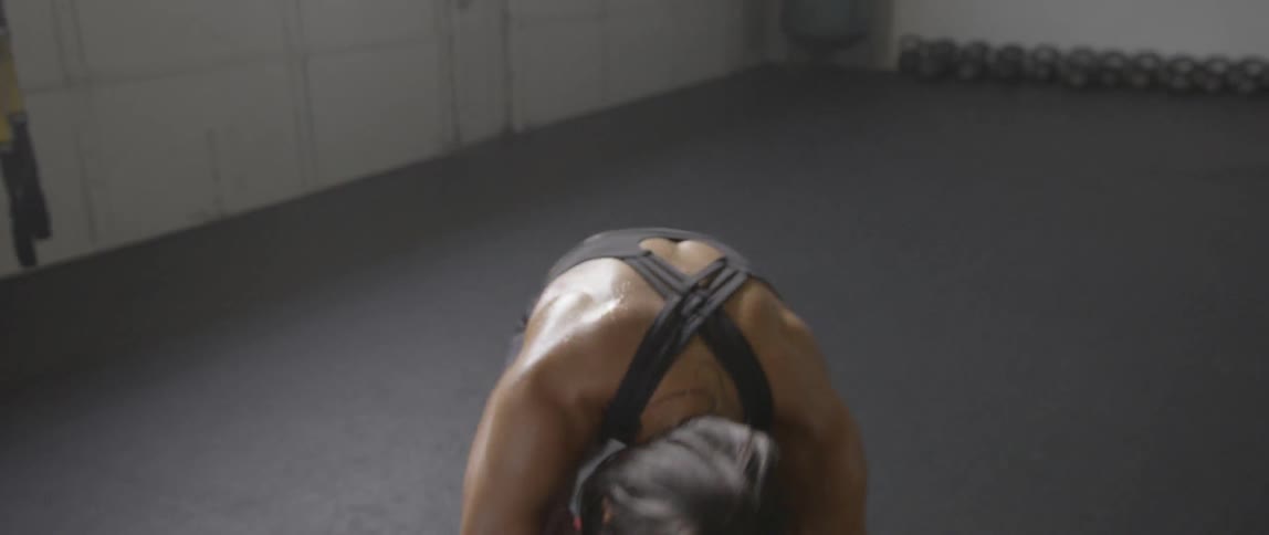A woman is exercising before jumping up