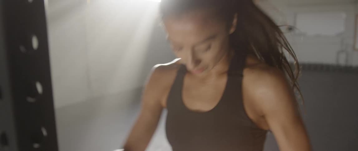 A woman stretches and warms up