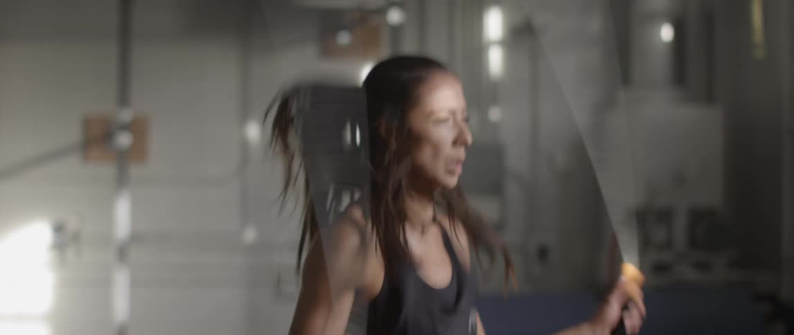 A woman jumps rope as a workout