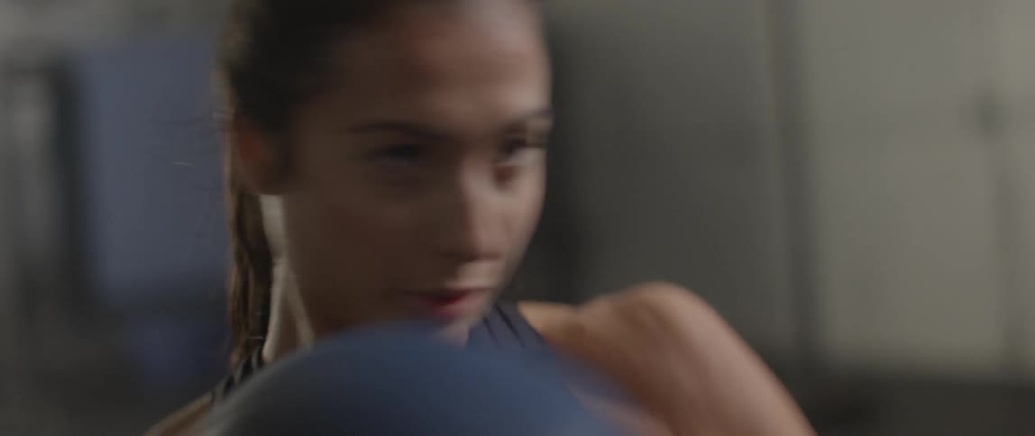 A woman is exercising with a ball