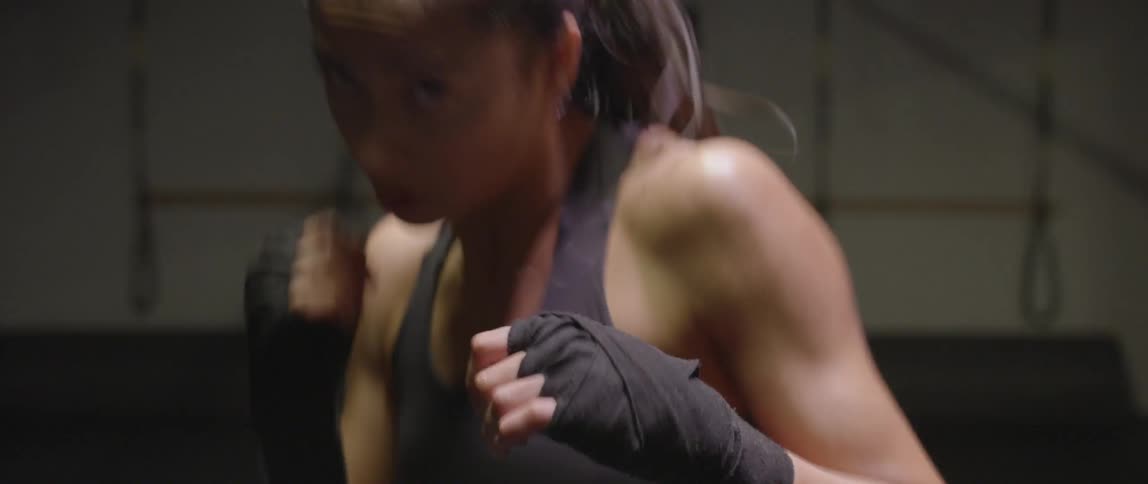 Woman spars and punches