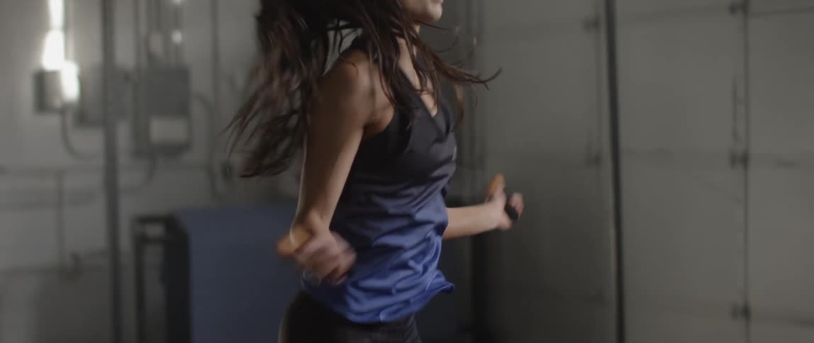 A woman is jumping rope