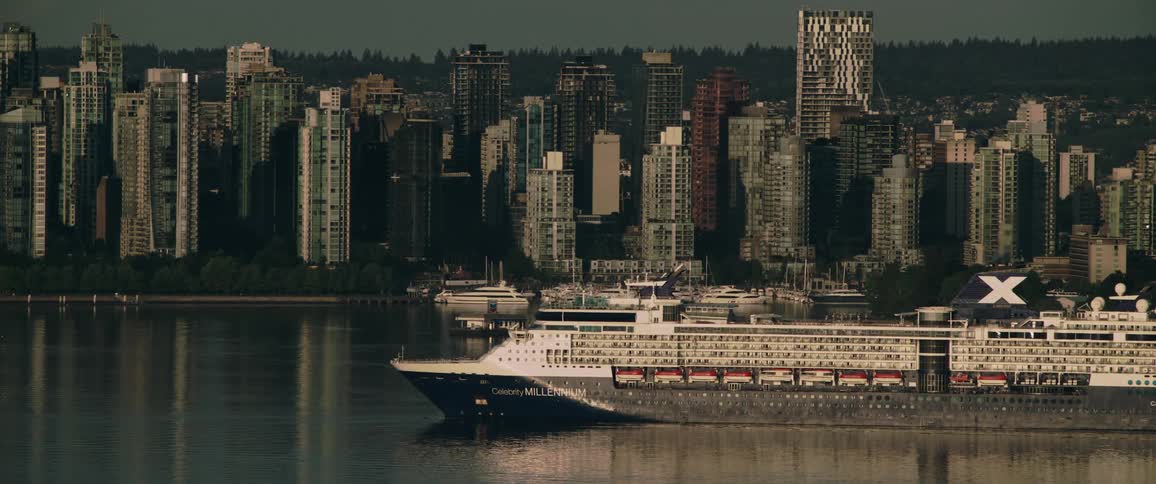 The ferry coasts past the city