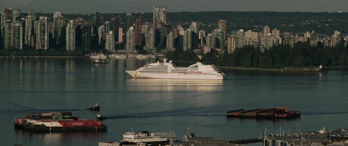 A cruise ship passes the city