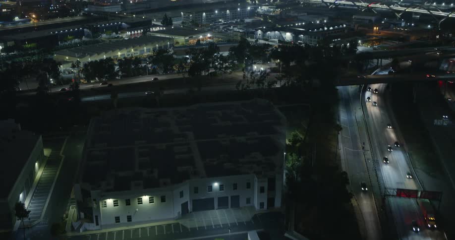 Traffic runs on the overpass at night