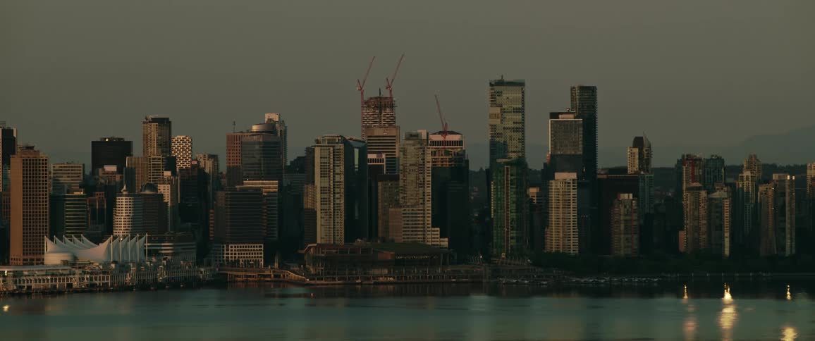 Metropolitan city with modern skyscrapers next to the marina