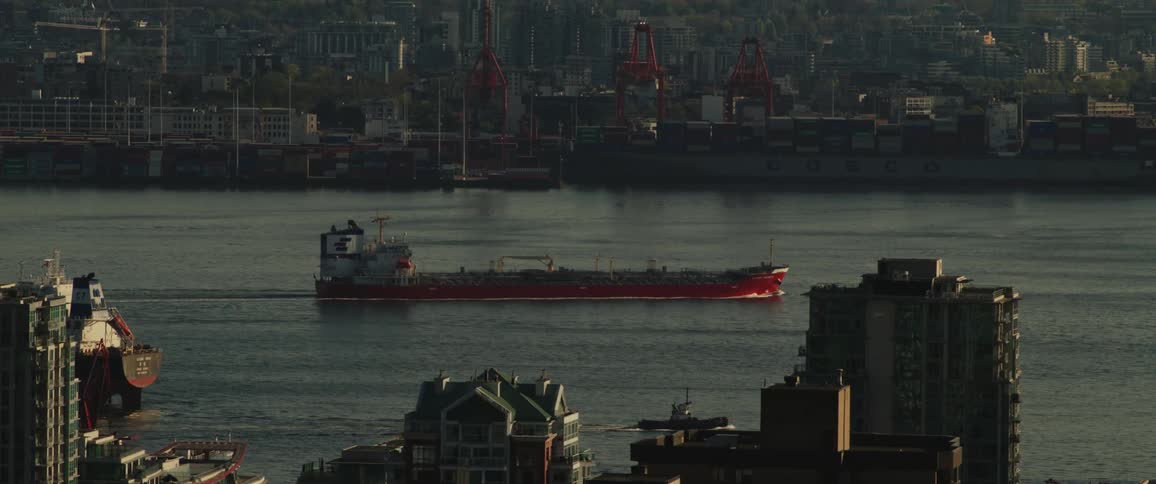 Cargo ship sailing near the city
