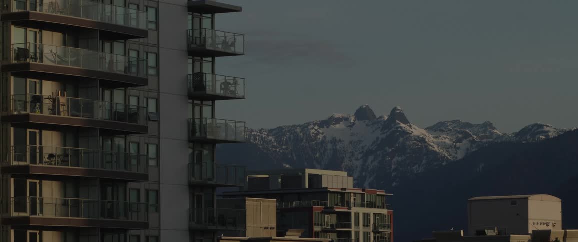 A building near the mountain landscape is displayed